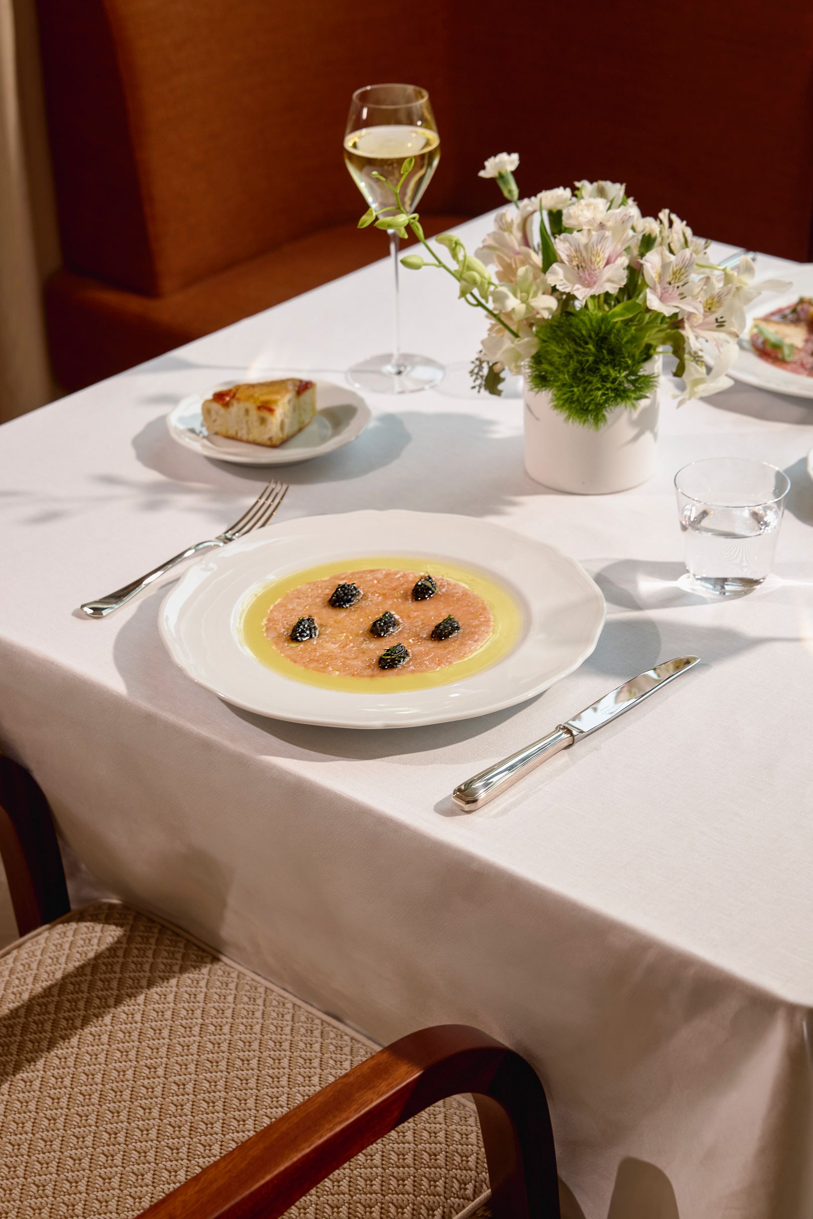 Seia Table With Caviar Dish And Flower Arrangement